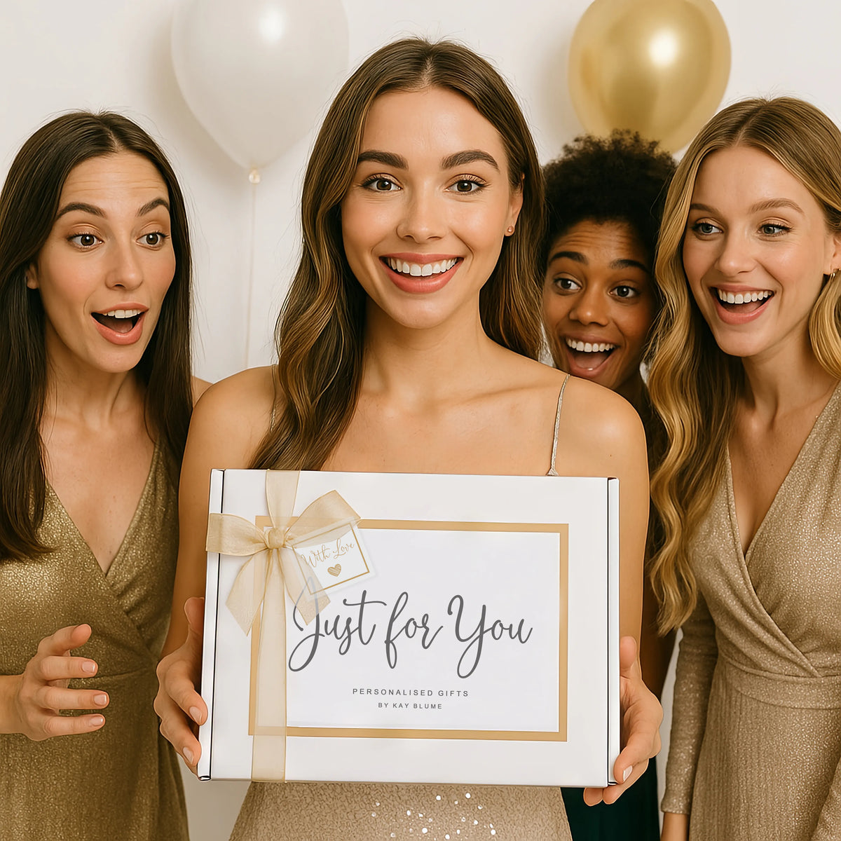 Luxury gift box presented by excited women, celebrating special occasions with joy and elegance.