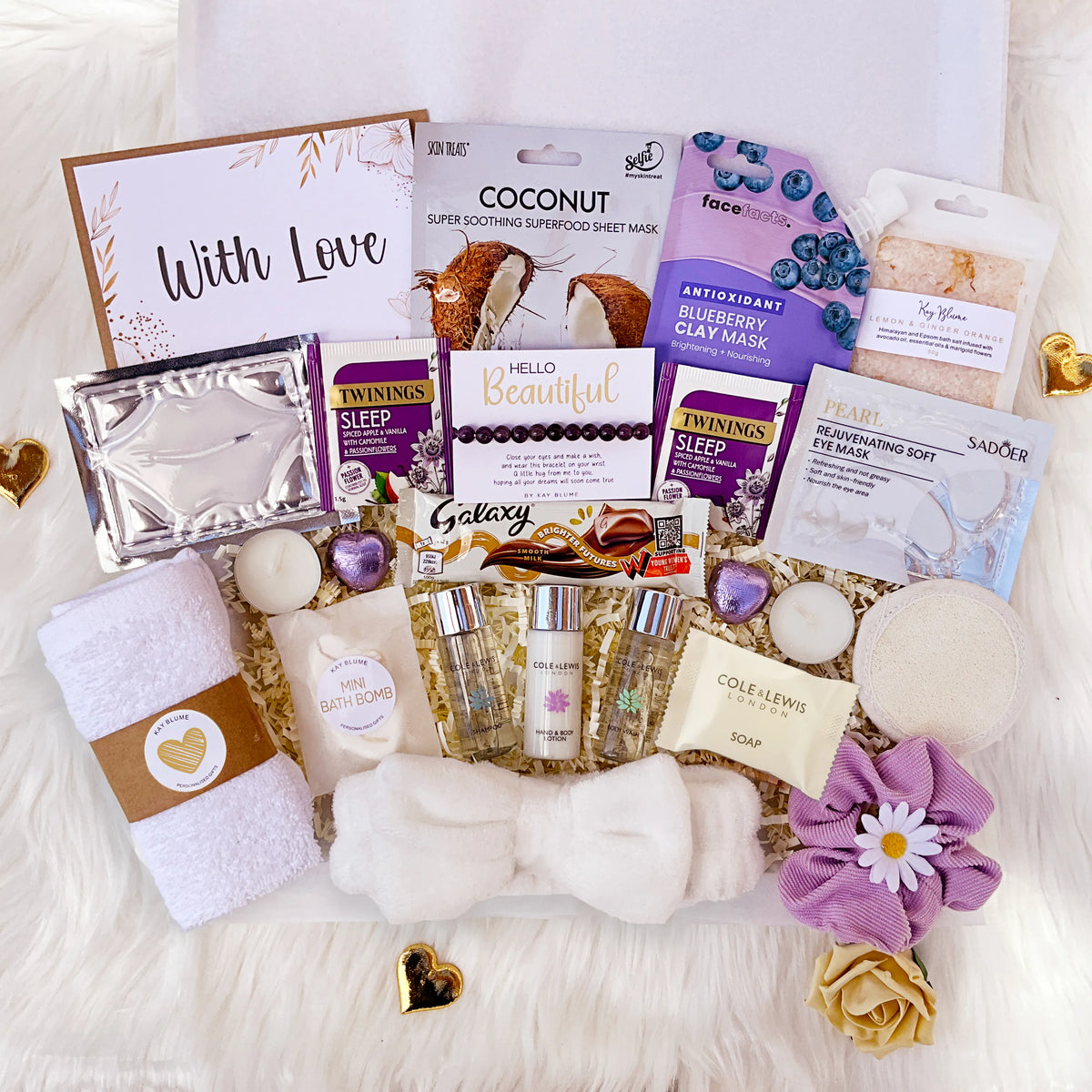 Spa gift box for her filled with self-care products like masks, bath items, and relaxing treats.
