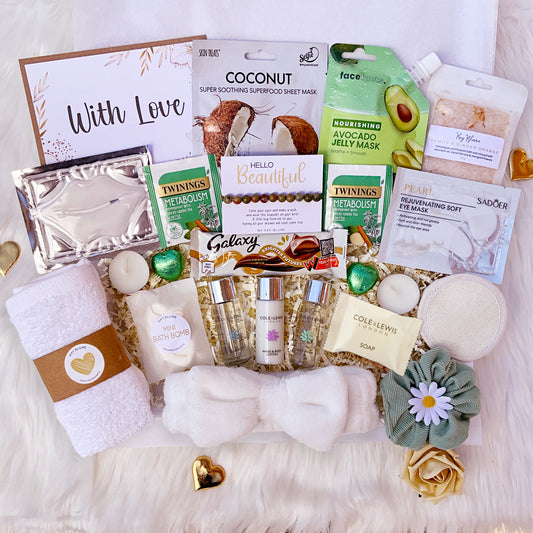 Spa Gift Box for her filled with self-care treats, including face masks, lotion, soap, and pampering accessories.